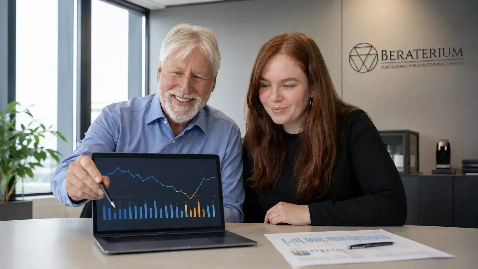 Business owner reviewing liquidity trends and cash flow metrics on a dashboard in the office